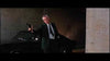 A man in a suit stands near a black car in a dimly lit area, aiming a handgun with one arm extended—a striking scene reminiscent of the neo-noir style featured in the rare and hard-to-find classic film Point Blank (1967), now available on DVD for collectors.