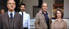 Four people—three men and one woman—stand indoors with serious, almost shocked expressions, as if reacting to the dramatic climax of the “Meteor (1979) DVD.” Computer equipment and boxes are visible in the background.