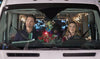 A man and a woman sit in the front seats of a vehicle adorned with Christmas lights and holiday ornaments, both smiling as they drive—perfectly capturing the joyful spirit depicted in *Holiday Road Trip (2013)*, now available on DVD.
