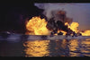 A warship ablaze and sinking at sunset evokes the intensity of World War II naval battles, reminiscent of scenes from the Pursuit of Graf Spee (1956) DVD.