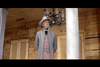 An older man in a gray military uniform and hat stands on a wooden porch under a chandelier, his hands clasped behind his back with two closed doors behind him—a scene reminiscent of classic westerns like Rio Conchos DVD (1964), a favorite among rare movie collectors.