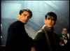 Two young men with dark hair sit at a bar, evoking a classic mafia vibe reminiscent of scenes from Killer Instinct DVD (1992), with dim lighting and other patrons enhancing the film's rare, hard-to-find atmosphere.