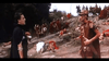 Two men dressed as Roman soldiers face off on rocky ground, with others in the background—a scene from Messalina (1960) DVD, a vintage classic film that captures the drama and allure of ancient Rome and cinematic history.