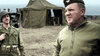 Two men in military uniforms stand by a green tent and sandbags at a WWII camp, evoking scenes from "Spoils of War (2009) DVD," one of the rare movies on DVD.