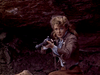 A woman with blonde hair in Old West attire crouches on rocky terrain, aiming a rifle with determination—a scene from the vintage classic "Fort Yuma (1955) DVD.