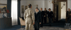 In an intense scene from Emperor (2012) DVD, a man in a khaki military uniform faces a man in a black suit and bow tie in a formal room, as other men in military uniforms observe during World War II.