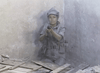 A person in military gear sits against a dusty wall, aiming a handgun forward, creating a tense scene reminiscent of rare classics like the Warhead (1977) DVD. Debris and wooden planks are scattered on the floor around them.