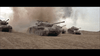 Four military tanks traverse sandy terrain under an overcast sky, echoing WWII action. Ideal for fans, the Tank Force (1958) DVD brings classic war movie excitement to your collection.