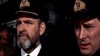 Two men in naval uniforms stand side by side on a ship—one serious and bearded, the other clean-shaven—from a scene in Attack on the Iron Coast (1968) DVD.