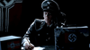 A person in a Nazi military uniform sits at a desk under dim lighting with Nazi flags, evoking scenes from classic films or the 2015 DVD "Flight World War II.