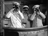 Three uniformed men with hats stand on a ship’s deck, scanning the horizon—an image reminiscent of the resolute Free French forces in Passage to Marseille (1944), now available on DVD.