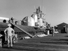 A black and white photo features sailors and officers beside the submarine TIGER SHARK SS 306, reminiscent of classic films. This image is included in the "Submarine Command (1951) DVD," showcasing the sub’s domes and deck equipment.