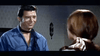 A man in a blue shirt and black neckerchief smiles at a woman with brown hair tied with a light ribbon, set indoors against a patterned wall—capturing the classic Western vibe of "Three Graves for a Winchester (1966) DVD.