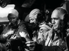 On The Wild Blue Yonder (1951) DVD, three WWII pilots in full flight gear sit side by side in a B-29 cockpit, concentrating on instruments and controls during intense aerial battles.