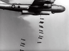 A B-29 bomber drops bombs in staggered formation, captured in black and white—a scene from World War II as depicted in "The Wild Blue Yonder (1951)" DVD.