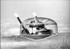 A gunner fires twin machine guns from a glass turret, muzzle flashes lighting the sky—a scene reminiscent of classic films like A Guy Named Joe (1943) DVD.