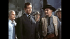 A woman and four men in Western attire stand together; the central man in a suit, others with cowboy hats and sheriff badges, evoking a classic scene from Silver Lode (1954) DVD.
