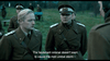 Two men in military uniforms stand outside, looking serious—one with a cap featuring a white band. This tense World War II scene is from "April 9th (2015)" on DVD, ideal for collectors of rare war films. Subtitles read: “The lieutenant colonel doesn’t want to cause the men undue alarm –”.