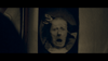 A sepia-toned, oval-framed photo shows a distressed person with a fearful expression and a hand pulling their hair—evoking the unsettling atmosphere of "The House That Jack Built (2018) DVD." The image is old and haunting.