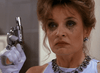 A woman with smudged eye makeup and an anxious look holds a revolver near her face, wearing jewelry and white gloves—capturing the suspenseful vibe of "Best Friends for Life (1998)" on DVD.