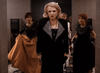 A woman in a black sequined outfit stands confidently in a restroom, holding a small object, as three alarmed women rush in—capturing the dramatic tension of "Best Friends for Life (1998)" on DVD.