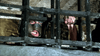 A distressed figure in a metal mask grips iron bars, evoking Alexandre Dumas' classic, as depicted in The Man in the Iron Mask (1977) DVD.