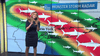 A weather presenter stands before a “Monster Storm Radar” map with shark illustrations and chaos worthy of Sharknado, echoing the excitement of "Sharknado 2: The Second One (2014) DVD" over New York—ideal for classic or rare movie collectors.