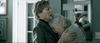 Two older women embrace in a dim room, one comforting the other as she cries on her shoulder—a touching moment reminiscent of scenes from Georgetown. Reflected in the mirror, their emotions echo the drama of the Georgetown (2019) DVD.