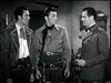 Three men in old Western-style attire stand indoors, evoking a classic movie scene reminiscent of "West of the Pecos (1945) DVD.