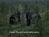 Five people in rugged clothing cross a grassy area; one raises an arm, another struggles. Subtitle: “Faster. This isn’t some damn picnic.” A tense moment from the classic Soviet war film, Come and See (1995) DVD.