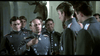 A group of men in military uniforms gather indoors; one raises a glass in toast while others look on. A mounted deer head hangs on the wall—evoking scenes from the Von Richthoften vs Brown (1971) DVD.