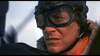 A close-up of a person in vintage aviation gear, embodying the daring pilots from World War I as seen in the movie "Von Richthofen vs Brown (1971)"—now available on DVD.