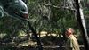 A man stands in a wooded area, gazing up in shock at a huge, menacing CGI fish with sharp teeth—like the creature from the Razortooth (2006) DVD—floating above him among the trees.