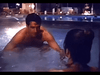 A shirtless man leans toward a woman in a softly lit pool at night, evoking the intimate mood found in rare hard-to-find movies like Murder in Texas (1981) DVD—perfect for true crime drama enthusiasts.
