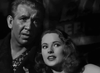 A black-and-white still from Nightmare Alley (1947) shows a concerned man on the left and a wavy-haired woman at his shoulder—ideal for classic movie fans looking for this film noir on DVD.