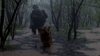 A helmeted figure in dark clothing crouches with a rifle, trailing a German Shepherd through a stormy, flooded forest—an intense scene echoing moments from the Rain (2006) DVD.