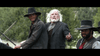 Three men in Old West outfits, with wide-brim hats and rugged jackets, sit outdoors among trees—evoking the comedic vibe of The Ridiculous 6 (2015) DVD.