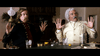 Two men sit at a table with drinks, poker chips, and money, both raising their hands in alarm—a scene reminiscent of The Ridiculous 6 (2015) DVD, perfect for fans of rare and quirky Western comedy films.