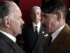 Two men in formal wear face off tensely as a suited man observes in the background, evoking the suspense of the World War II drama Countdown to War (1989) DVD, starring Ian McKellen as Hitler.