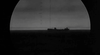Through a submarine periscope’s crosshairs, a ship silhouette evokes WWII suspense—just like scenes from "Hellcats of the Navy (1957)" DVD.