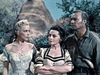 Three people stand outdoors in front of rocky terrain; two women in vintage dresses face a man in a dark shirt, evoking the classic western style of the Kentucky Rifle (1955) DVD.