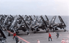 Navy fighter planes with folded wings line up on an aircraft carrier at sea as crew members work around them, capturing a scene reminiscent of Flat Top (1952) DVD.