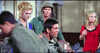 A group, including two soldiers and two women, are indoors; one soldier holds a weapon with a swastika visible—a classic WWII action drama featured in Legion of No Return (1969) DVD.