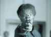 A person points a handgun at the camera, their face and background blurred, capturing the dramatic intensity found in Judgement Day: The Ellie Nesler Story (1999) DVD.