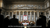 A grand hall with statues and a “Friedens Kongress Bern” banner is seen in Madame Nobel (2014) DVD, as a speaker addresses an audience. Perfect for any world cinema collection, subtitle: “and this murderous system has got to come to an end.”.