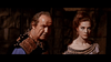 A man in ornate ancient attire stands beside a red-haired woman in a lavish dress, both serious against a stone wall—capturing the vintage sword-and-sandal vibe of "Goliath and the Dragon (1960)" DVD.