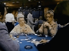 Four people sit around a poker table with cards and chips, capturing the tension of a compulsive gambling drama. Two women face the camera—one older, one younger—evoking characters from rare classic films such as those found on the Winner Take All (1975) DVD. Other players and casino tables appear in the background, enhancing the vintage casino atmosphere.