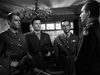 Three men in military uniforms stand in an elegantly decorated room, evoking the suspenseful atmosphere of a WWII espionage thriller—just like you'll experience with the "Operation Secret (1952) DVD.