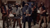 Six cowboys wearing hats and bandanas over their faces stand indoors, holding guns, in a tense Spaghetti Western movie scene—a thrilling moment from “The Savage Guns (1962) DVD,” a classic film cherished by collectors.