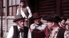Five men in Old West outfits stand outside a wooden building, reminiscent of scenes from The Last Gun (1964) DVD—a must-have for Western film enthusiasts who cherish classic Spaghetti Western moments.